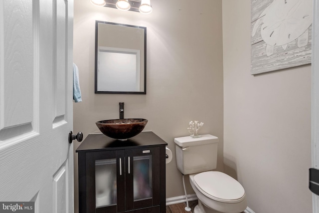 bathroom featuring toilet and vanity