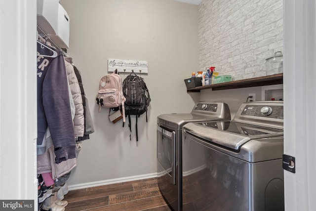 laundry room with dark hardwood / wood-style floors and independent washer and dryer