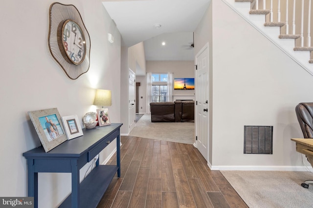 hall with dark hardwood / wood-style flooring