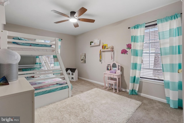 bedroom with light carpet and ceiling fan