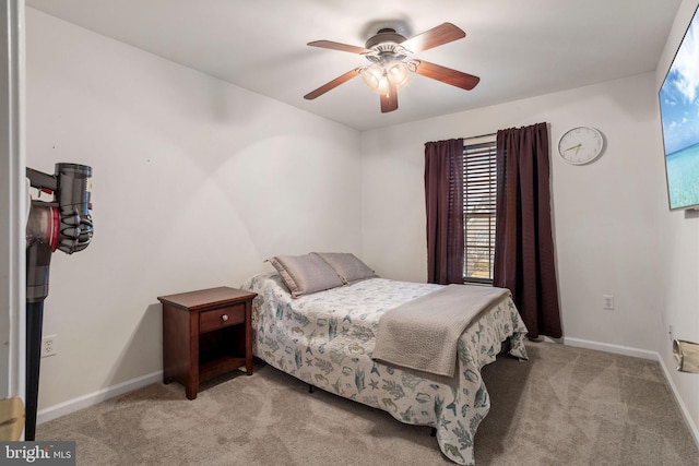 bedroom featuring ceiling fan and light carpet