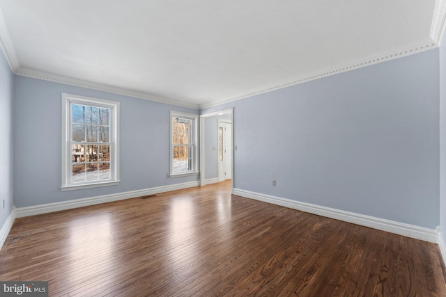 empty room with wood-type flooring and ornamental molding