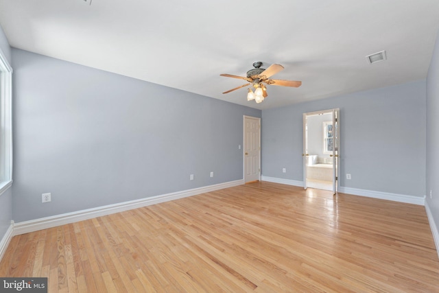 spare room featuring ceiling fan and light wood-type flooring