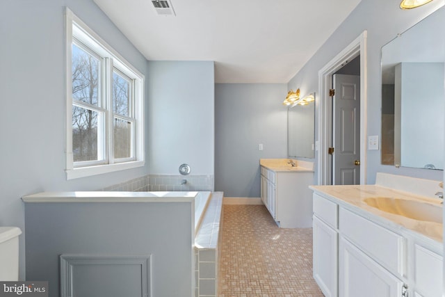 bathroom featuring tile patterned flooring and vanity