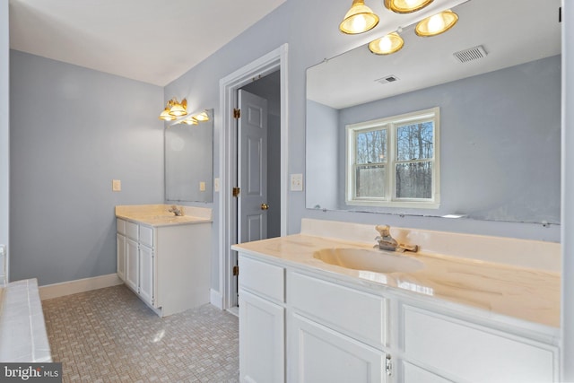 bathroom with vanity and tile patterned floors