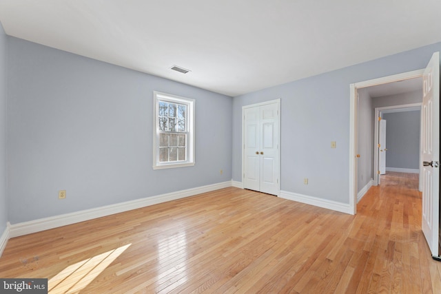 unfurnished room featuring light wood-type flooring