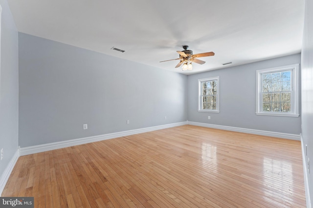 unfurnished room with ceiling fan and light wood-type flooring