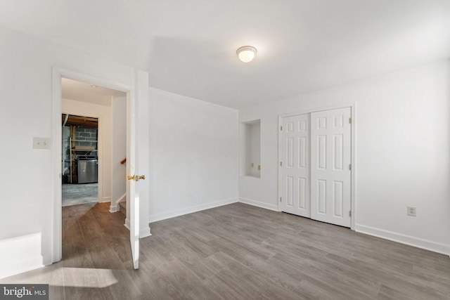 spare room with wood-type flooring