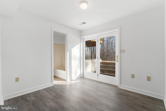 unfurnished room with dark hardwood / wood-style floors