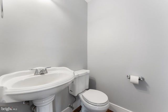 bathroom with sink and toilet