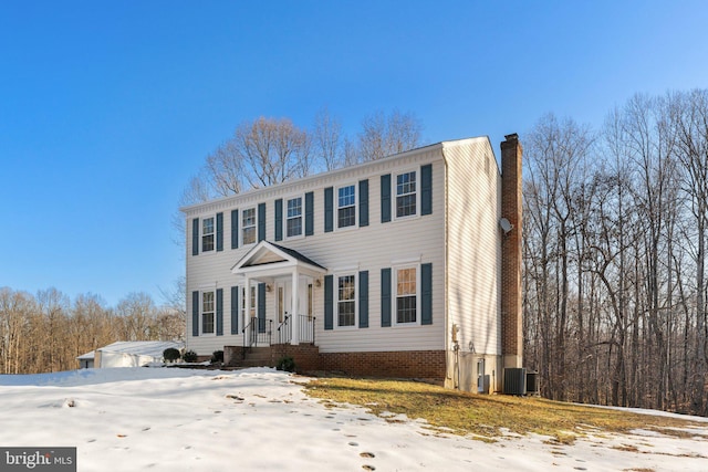 colonial inspired home with central air condition unit