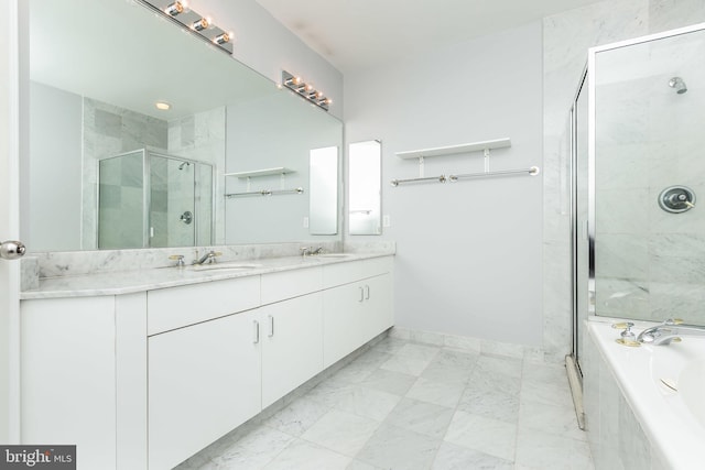 bathroom featuring shower with separate bathtub and vanity