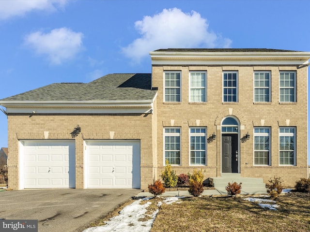 view of front of property with a garage