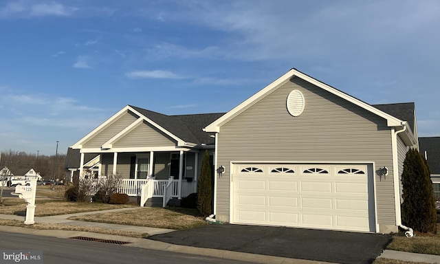 view of front of home featuring a garage and covered porch