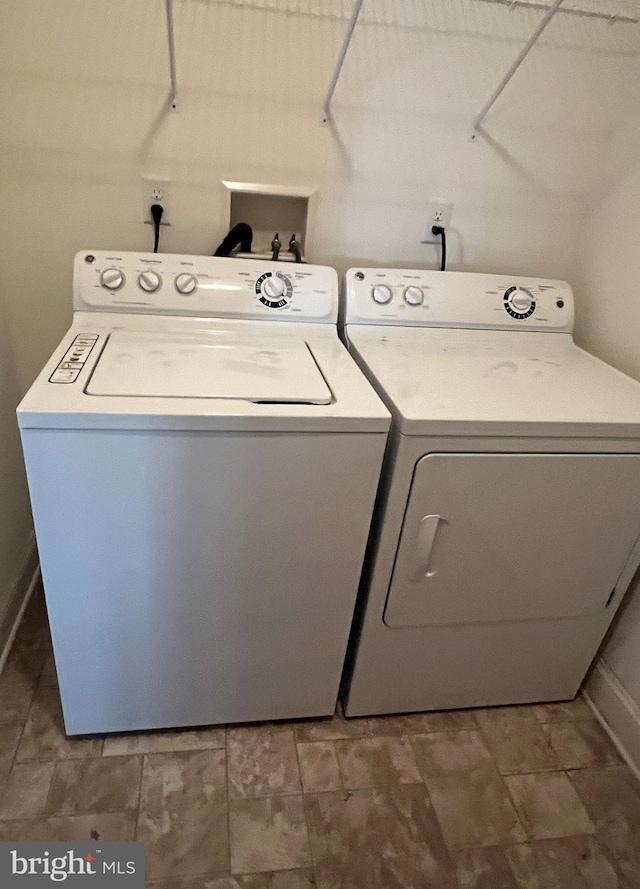 laundry room featuring washing machine and clothes dryer