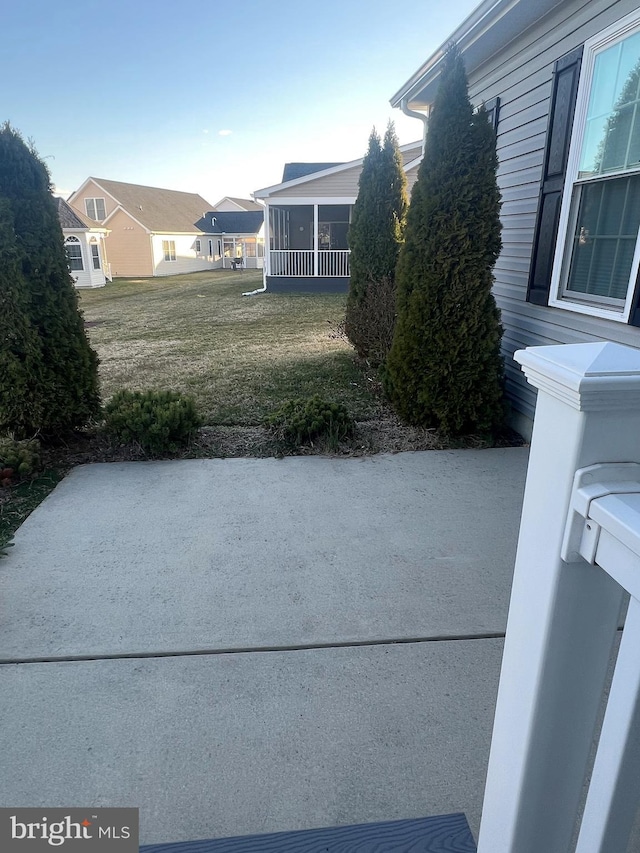 view of yard featuring a sunroom