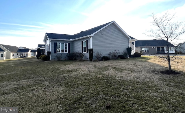 view of property exterior with a yard