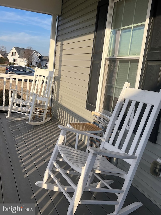 wooden terrace featuring a porch