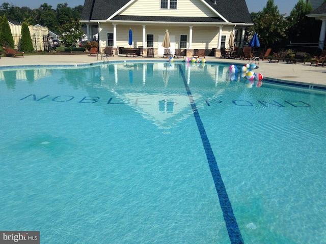 view of swimming pool with a patio area