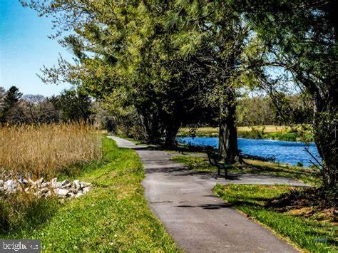 surrounding community featuring a water view