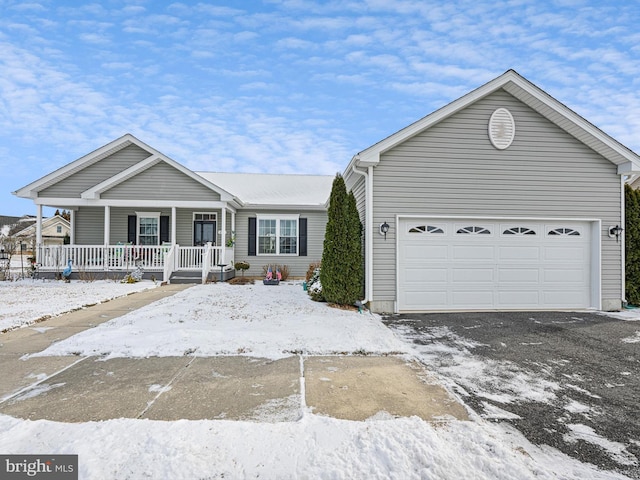 view of front of property with a garage and a porch