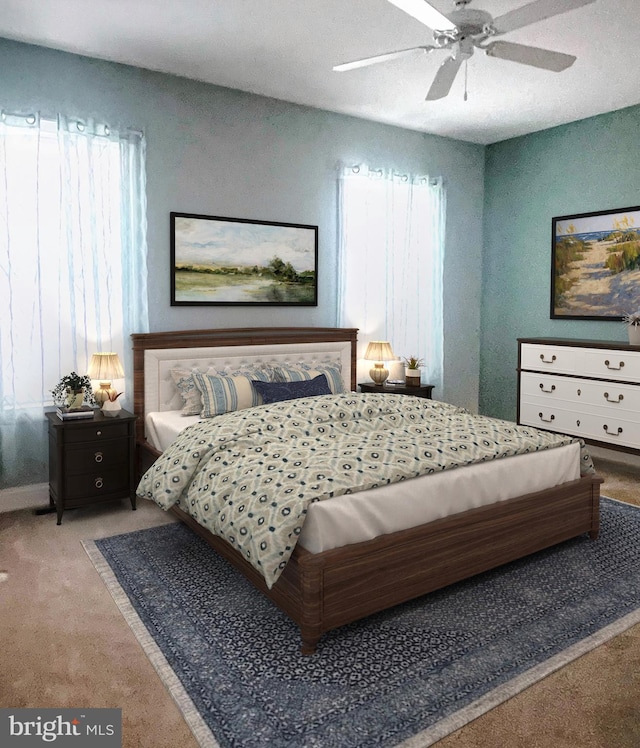 bedroom featuring light carpet and ceiling fan