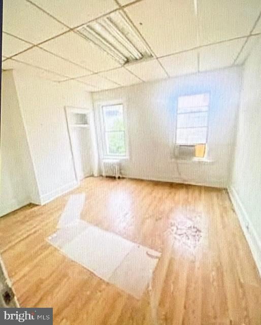 interior space featuring hardwood / wood-style flooring and radiator heating unit