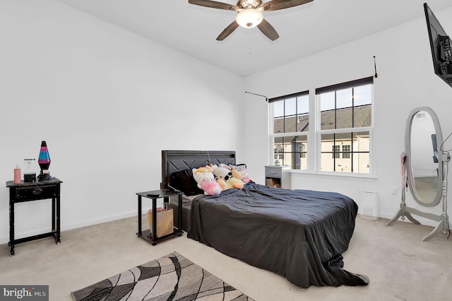 bedroom with light colored carpet and ceiling fan