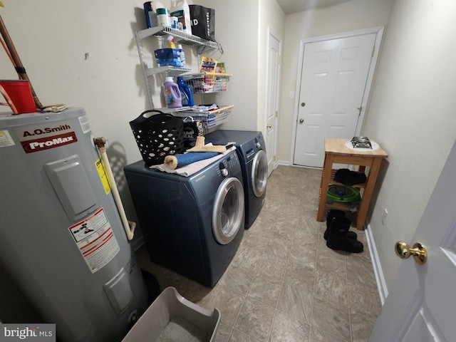 washroom with separate washer and dryer and water heater