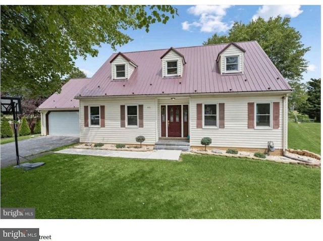 new england style home featuring a garage and a front lawn