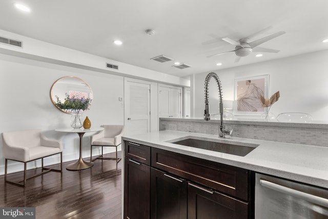 kitchen featuring dishwasher, dark wood-type flooring, tasteful backsplash, sink, and ceiling fan