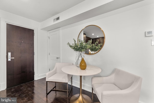 dining area featuring dark hardwood / wood-style flooring