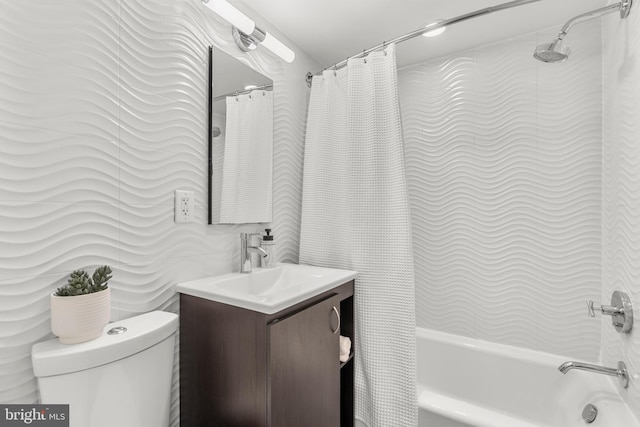 bathroom featuring shower / bath combo with shower curtain, tile walls, and vanity