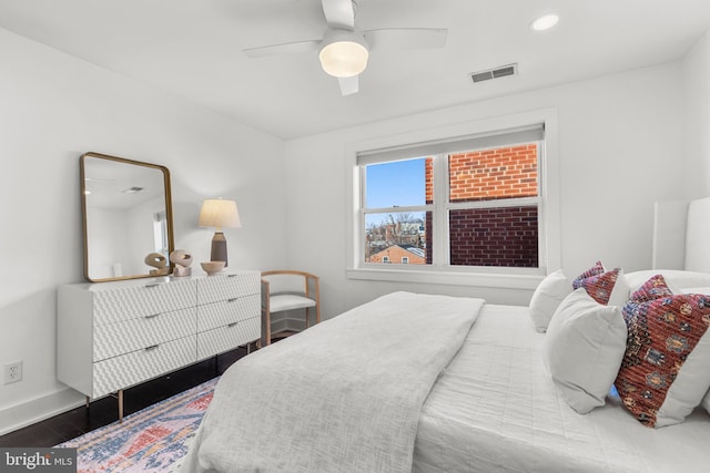 bedroom with ceiling fan and hardwood / wood-style floors