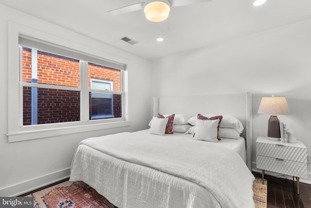 bedroom featuring ceiling fan and dark hardwood / wood-style flooring