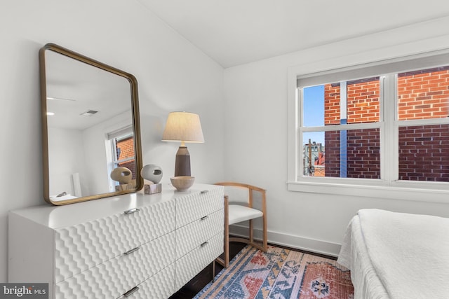 bedroom featuring multiple windows