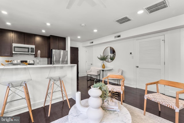 dining area with dark hardwood / wood-style floors