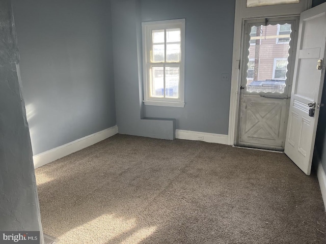 unfurnished room with carpet floors