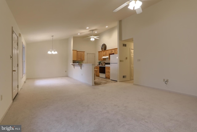 unfurnished living room with high vaulted ceiling, light carpet, and ceiling fan with notable chandelier