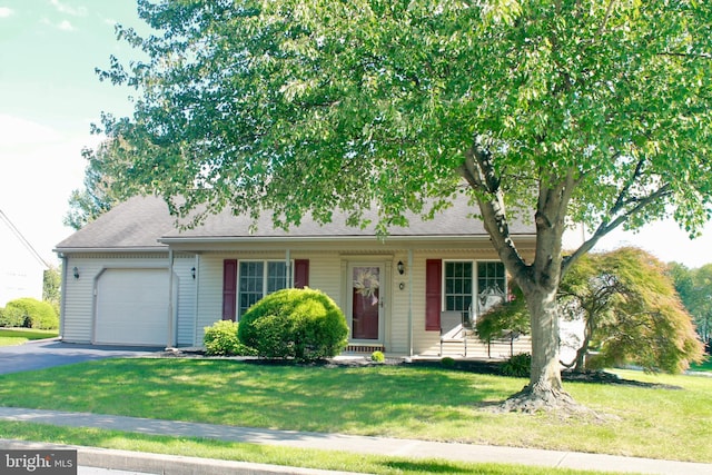 ranch-style house with a front lawn and a garage