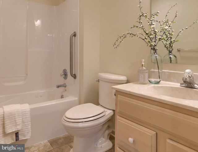 full bathroom featuring toilet, vanity, tile patterned floors, and  shower combination