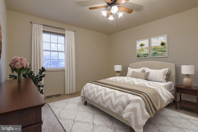 bedroom with light carpet and ceiling fan