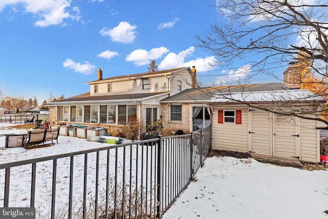 view of snow covered house