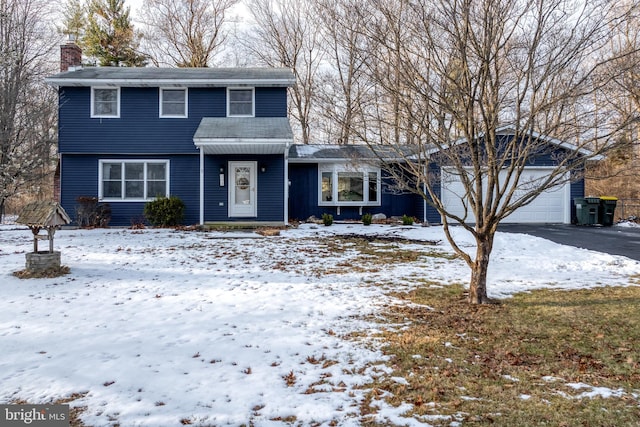 front of property with a garage