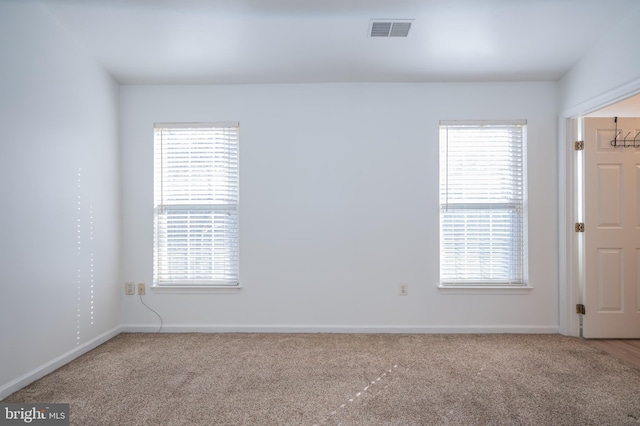 spare room featuring carpet flooring