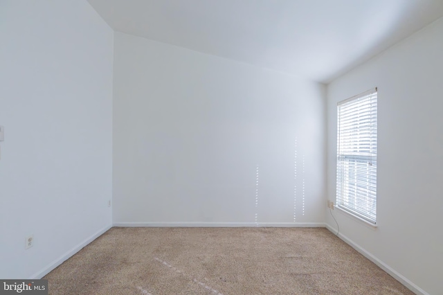 empty room featuring light colored carpet