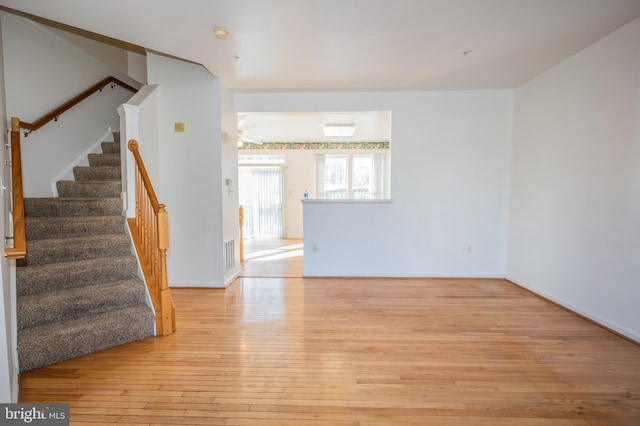 unfurnished room featuring light hardwood / wood-style floors