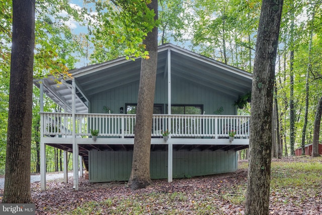 view of side of property featuring a wooden deck