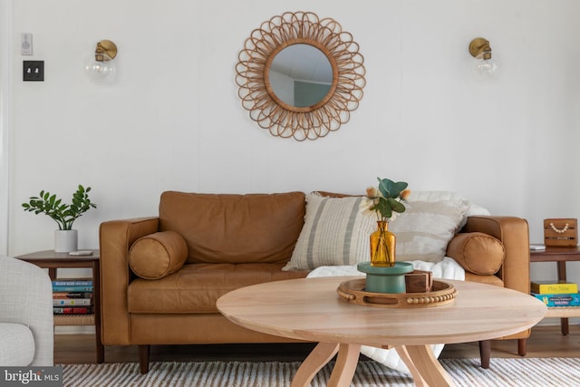 living room with wood-type flooring and breakfast area