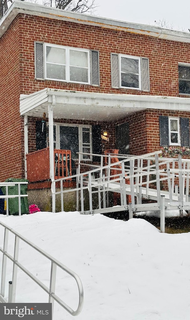 view of snow covered property